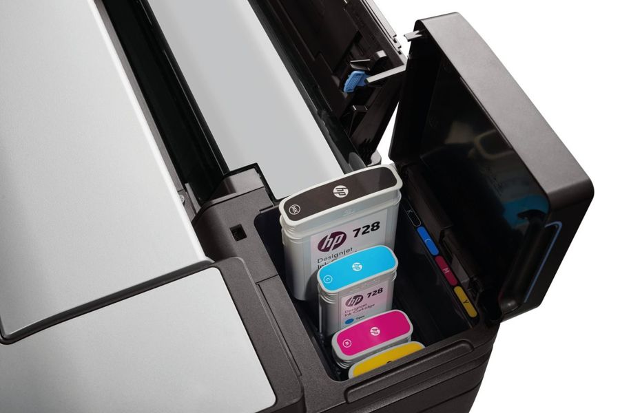 Genuine HP 728 ink cartridges in an HP DesignJet plotter